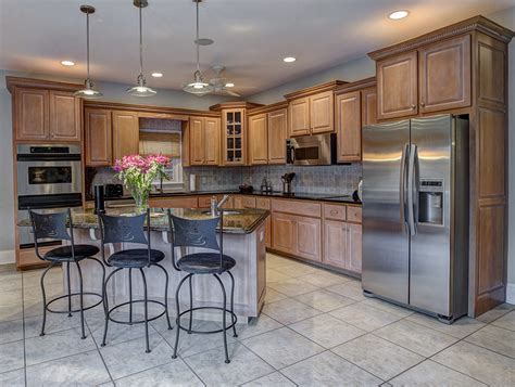 steel grey granite with honey oak cabinets|decorating around honey oak cabinets.